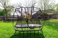 Load image into Gallery viewer, a young girl jumping high on a trampoline
