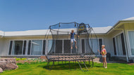 Load image into Gallery viewer, Kids playing basketball on an outdoor trampoline
