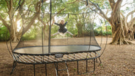 Load image into Gallery viewer, Little girl doing high splits on outdoor trampoline