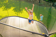 Load image into Gallery viewer, Girls playing around trampoline

