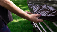 Load image into Gallery viewer, hands of a lady putting a cover to an outdoor trampoline
